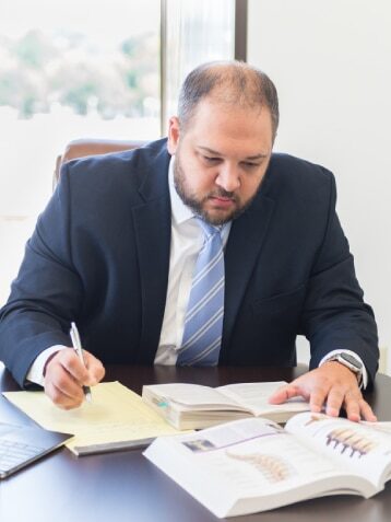 Chad Ikerd reviewing case materials at his desk